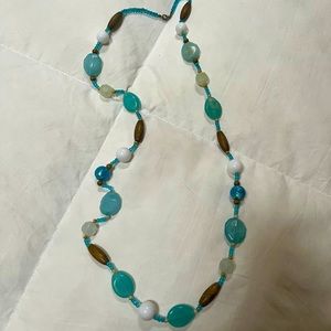 Neckless beads turquoise and brown beautiful in summer in the neck